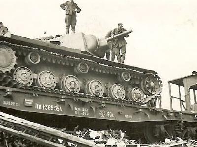 KV 1 tank on abandoned railway car