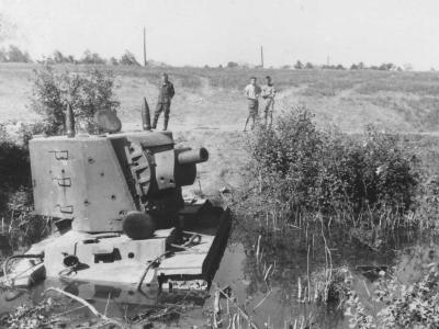 KV-2 tank model 1940 with early turret stuck in a muddy river bed