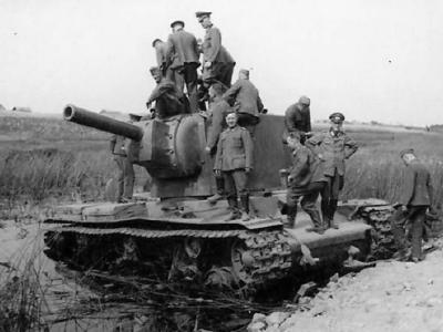 German soldiers examining knocked out heavy tank KV2