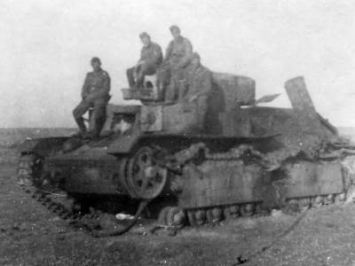 German troops pose next to a captured and destroyed T-28