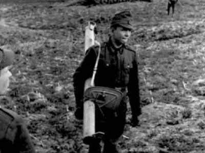 Soldier with Panzerschreck and destroyed T-34 tank