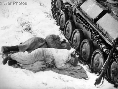 Tank crew sleep near their T-70
